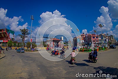 NAGARKOT, NEPAL OCTOBER 11, 2017: Close up of some people riding their motorbikes around the city in Nagarkot Nepal Editorial Stock Photo