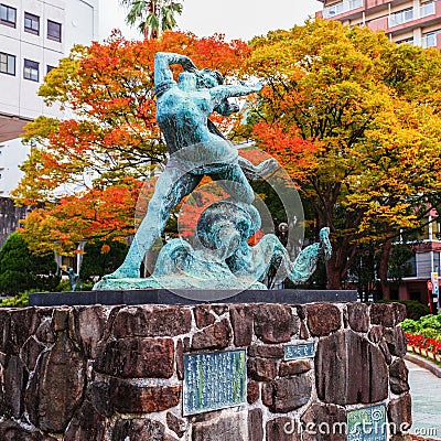 Nagasaki, Japan - November 14 2013: Girl and Octopus sculpture c Editorial Stock Photo