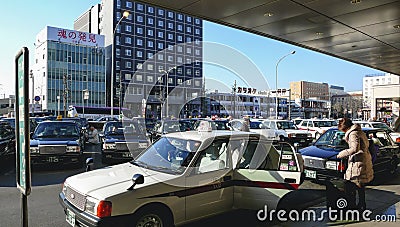 NAGOYA, JAPAN - JAN 29, 2014 : Taxi Stand with people Passenger with luggage Nagoya train station City Transportation Editorial Stock Photo