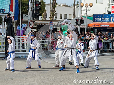 Participants of the Karate section show their skills at the carnival of Adloyada in Nahariyya, Israel Editorial Stock Photo