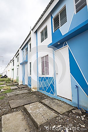 Naic, Cavite, Phililippines - Rows of newly built low-cost housing. Cheaply constructed Row houses Editorial Stock Photo