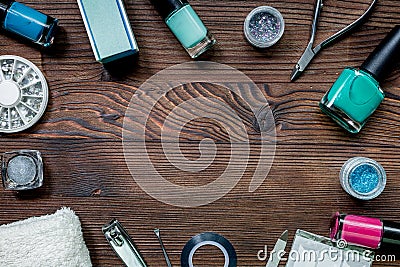 Nail artist desk with manicure set and nail polish for hands care wooden background top view mockup Stock Photo