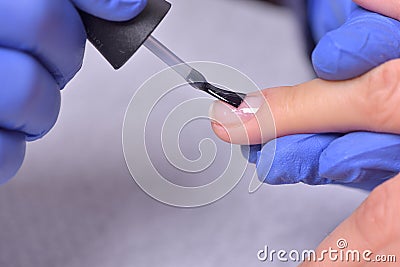 Nail Care And Manicure. Closeup Of Beautiful Female Hands Applyi Stock Photo