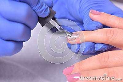 Nail Care And Manicure. Closeup Of Beautiful Female Hands Applyi Stock Photo