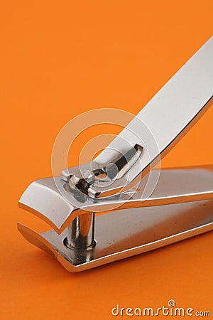 Nail clippers on orange Stock Photo