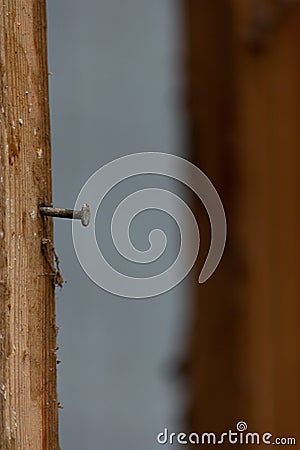 Nail in old wooden framing of house ready for repair Stock Photo