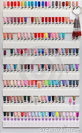 Nail polish samples of different bright colors on a white background Editorial Stock Photo