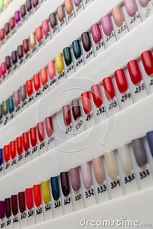 Nail polish samples of different bright colors on a white background Editorial Stock Photo