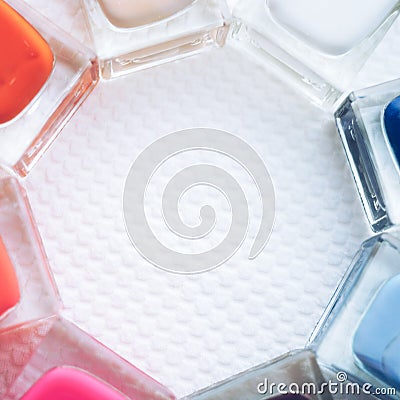 Nail polish set. Glass bottles different colors on a white table Stock Photo