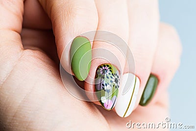 Nails Design. Hands With Bright Green and White Manicure On White Background. Close Up Of Female Hands. Art Nail. Olive manicure Stock Photo