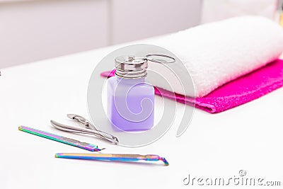 Nails saloon nail polish remover with manicure tools on white Stock Photo