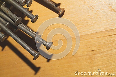 Nails on a wooden background.working tools Stock Photo