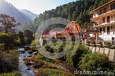 Ancient Hindu temple in the mountains region with scenic landscape at Nainital Uttarakhand India Editorial Stock Photo
