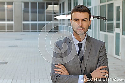 Naive businessman who doesn`t know he has been betrayed Stock Photo