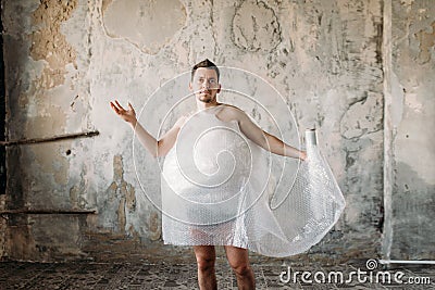 Naked freak man wearing shoes without laces Stock Photo