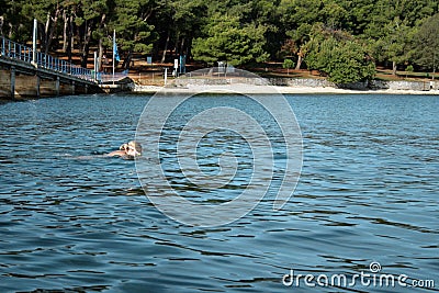 Naked woman on the nudist beach Stock Photo