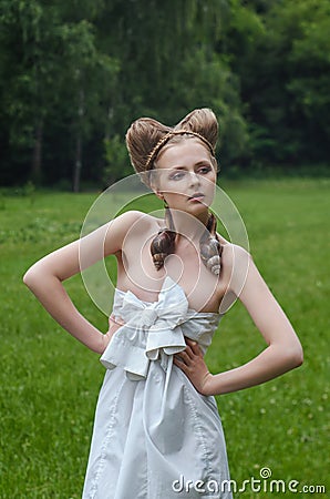 Naked young woman with fashion hairstyle and two big snails Stock Photo