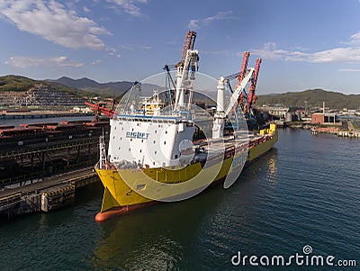 Nakhodka, Russia - May 16, 2017: The vessel for transportation of large cargoes Happy Sky standing at the coal terminal. Editorial Stock Photo