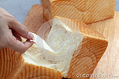 NAMA Shokupan or japanese bread loaf on wooden board Stock Photo