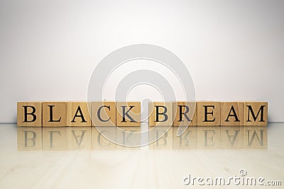 The name Black bream was created from wooden letter cubes. Seafood and food. Stock Photo