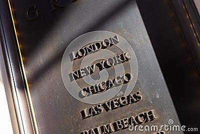 Name of the cities graven on entrance of the hotel in London Editorial Stock Photo