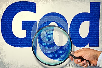 The name GOD under observation with magnifying glass Stock Photo