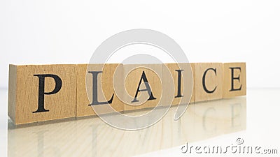 The name Plaice was created from wooden letter cubes. Seafood and food. Stock Photo