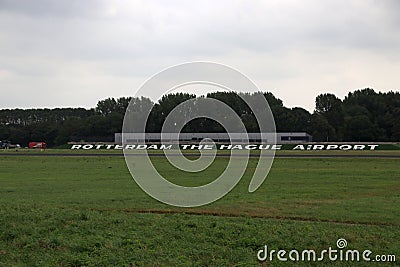 Name of the Rotterdam The Hague Airport in the Netherlands along the runway in the Netherlands on a Editorial Stock Photo