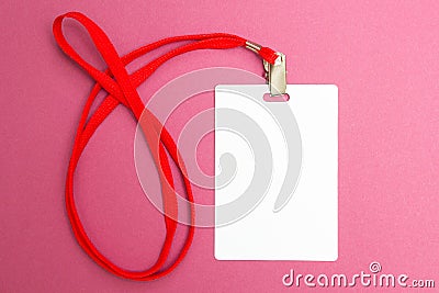 Name tag mockup isolated on pink background. Plain empty badge id mock up hanging on neck with red string Stock Photo