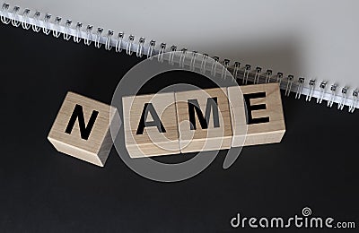 NAME word on cubes blocks on black and white background Stock Photo