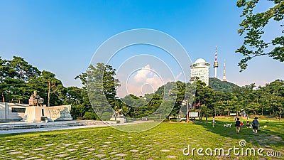 Namsan Park in the beautiful sunset with the statue of Lee Si-yeong, the first Vice President of South Korea, and relaxing Editorial Stock Photo