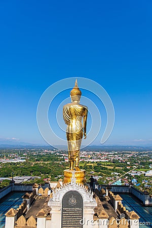 The standing golden Buddha at a hill or valley at Wat phra that khao noi,Nan Thailand. Editorial Stock Photo