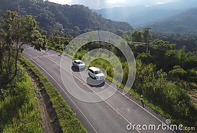 Nan, Thailand. Aerial view of Beautiful sky road over top of mountains with green jungle. Road trip on curve road in mountain. Editorial Stock Photo