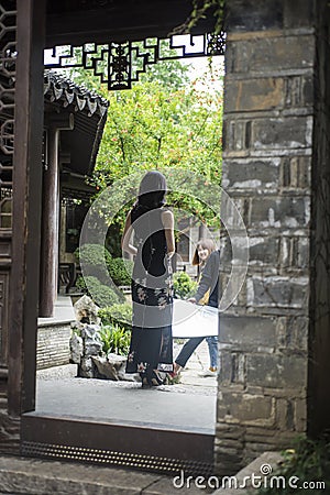 Bride photographing wedding photos in scenic area Editorial Stock Photo