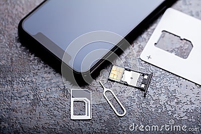 Nano Sim Card In The Card Adapter With Eject Pin Stock Photo