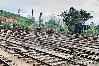 NANU OYA, SRI LANKA - JULY 17, 2016: Workers at a train station in Nanu Oya village, Sri Lan Editorial Stock Photo