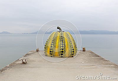 NAOSHIMA, JAPAN. MAY 6: Yayoi Kusama`s giant pumpkin sculpture i Editorial Stock Photo