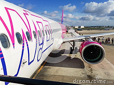 Big white purple and blue aeroplane of Wizzair on airport Editorial Stock Photo