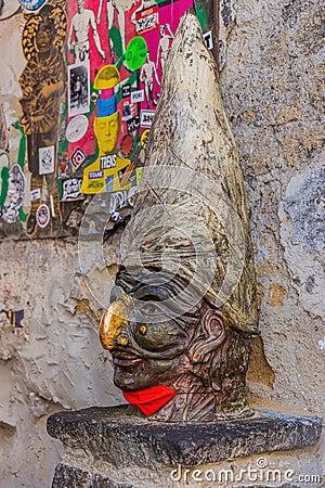 NAPLES, ITALY - JULY 18 2021: Sculpture of Pulcinella with protective face mask. Editorial Stock Photo