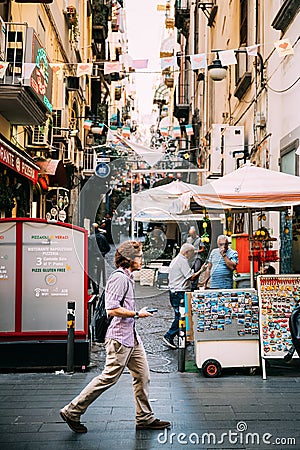 Naples, Italy. Young Caucasian Man Tourist Walking At Famous Via Toledo Street Editorial Stock Photo