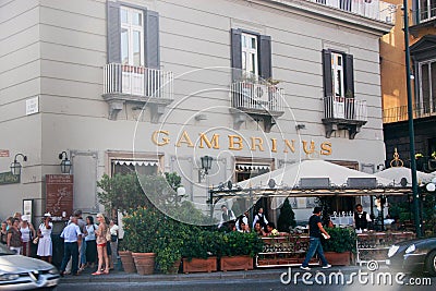People stay at old cafe Gambrinus on Piazza Trieste Trento Editorial Stock Photo