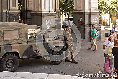 Naples, Italy - September 28, 2023: Military patrol with weapons still standing in front of Naples Cathedral, Cathedral of St. Editorial Stock Photo