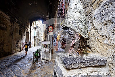 Naples - Traditional mask with face of Pulcinella in Spaccanapoli Streets in the old town of Naples, Italy Editorial Stock Photo