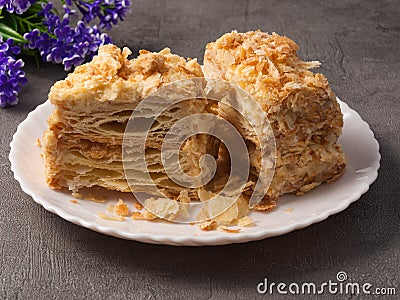 Napoleon cake. a piece of airy tender puff pastry on a plate Stock Photo