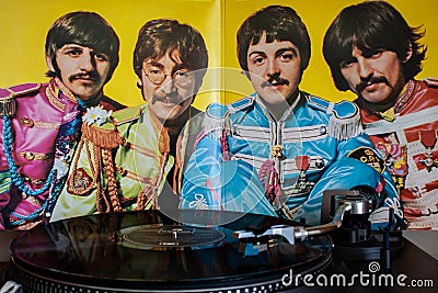 Turntables with the Beatles vinyls in the background. Editorial Stock Photo