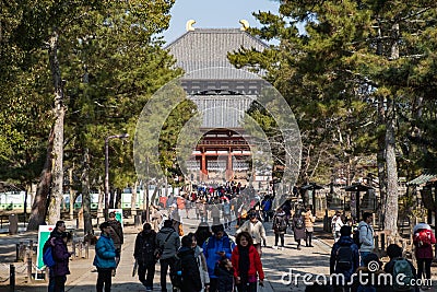 NARA, JAPAN - JAN 30, 2018: Tourists walking in entrance of Todaiji giant temple in Nara Editorial Stock Photo