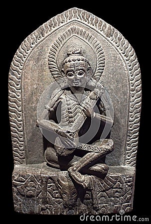 Narada - heavenly musician. Ancient Nepalese wooden statuette. P Stock Photo