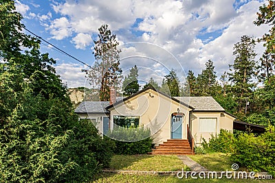 NARAMATA, CANADA - JULY 5, 2020: Cute small country private house with garden on sunny summer day Editorial Stock Photo