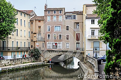 Narbonne, France and the Canal de la Robine. Houses on bridge Stock Photo