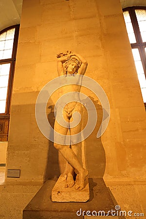 Narcissus, known as the `Mazarin Hermaphrodite` statue at Louve museum in Paris Editorial Stock Photo